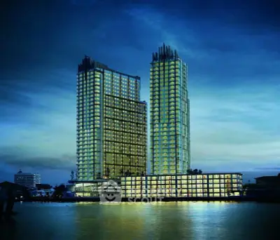 Stunning waterfront twin towers with modern architectural design and illuminated windows.