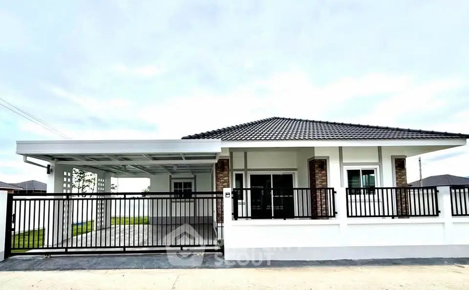 Modern single-story house with sleek design and spacious driveway