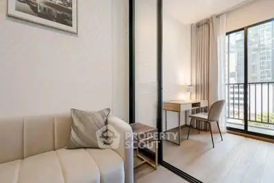Modern apartment with cozy living area and stylish study nook, featuring floor-to-ceiling windows and elegant decor.