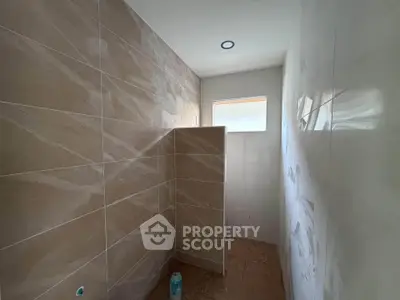 Modern bathroom with sleek tile design and natural light