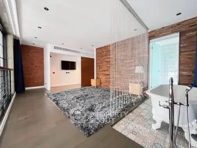 Spacious modern living room with unique bathtub feature and stylish decor