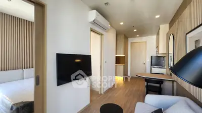 Modern apartment interior with sleek design, featuring a cozy living area and stylish bedroom.