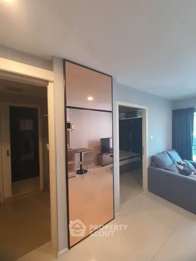 Modern apartment interior with sleek design and open living space, featuring a cozy living room and stylish decor.