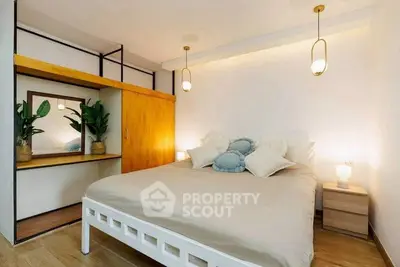 Cozy bedroom with modern decor and warm lighting