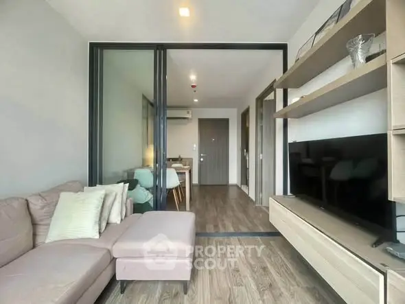 Modern living room with sleek furniture and open layout in a stylish apartment.