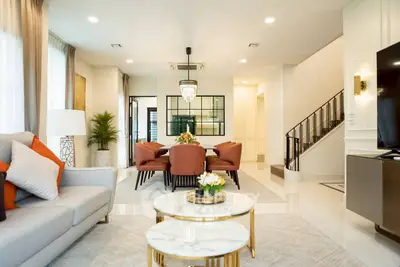 Luxurious living room with elegant dining area and modern decor