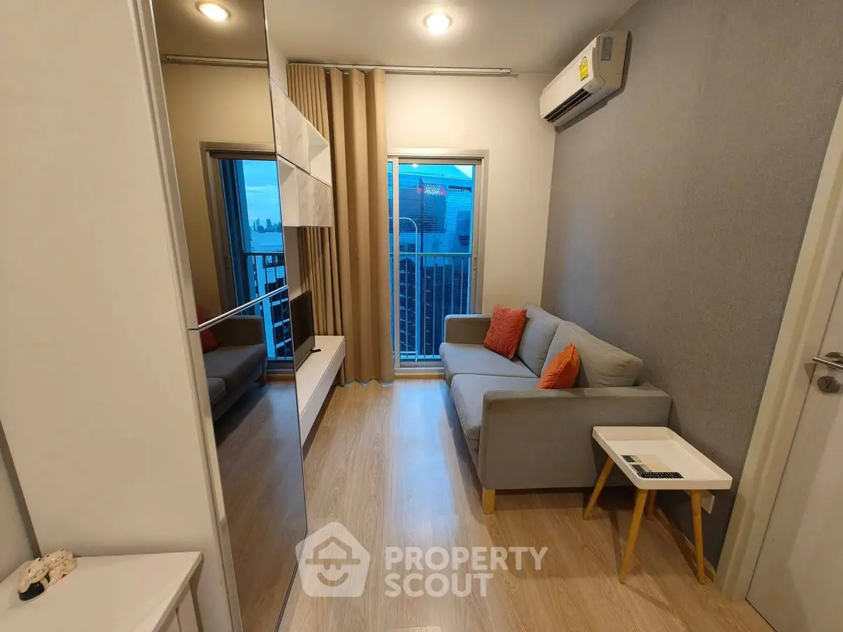 Modern living room with cozy sofa and city view balcony in stylish apartment.