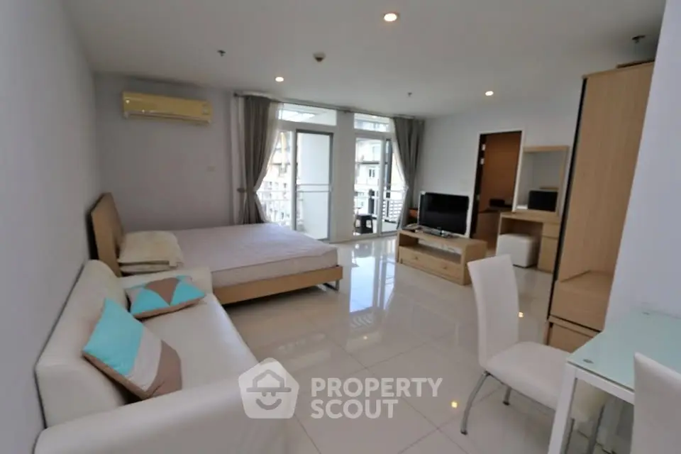 Spacious modern studio apartment with elegant furnishings and natural light