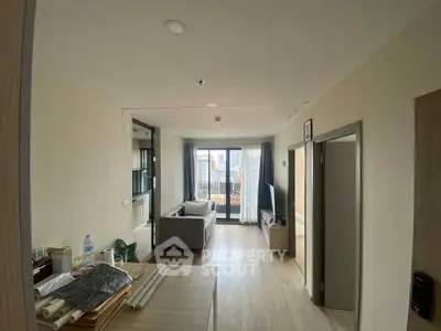 Modern living room with balcony view and sleek furniture design