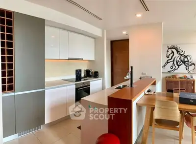 Modern kitchen with sleek cabinetry and open layout in a stylish apartment.