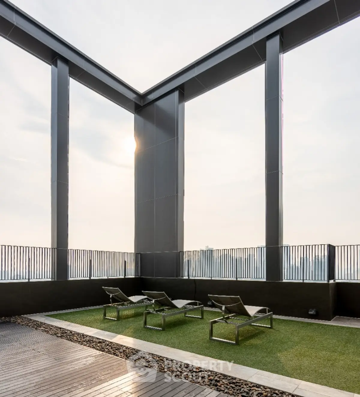 Luxurious rooftop terrace with modern lounge chairs and stunning city views.