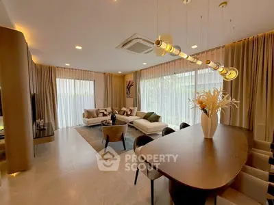 Luxurious modern living room with elegant dining area and stylish decor