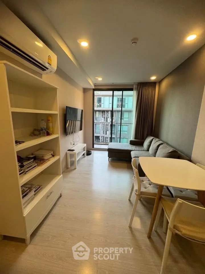 Modern living room with cozy sofa and dining area in a stylish apartment