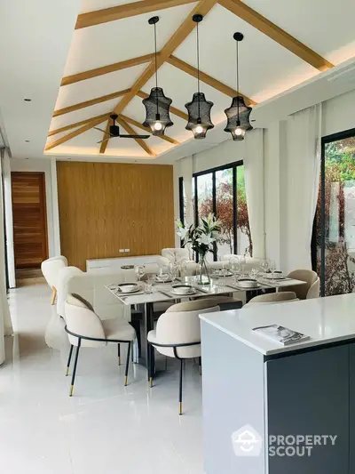 Luxurious dining area with elegant decor and modern lighting in a stylish home.