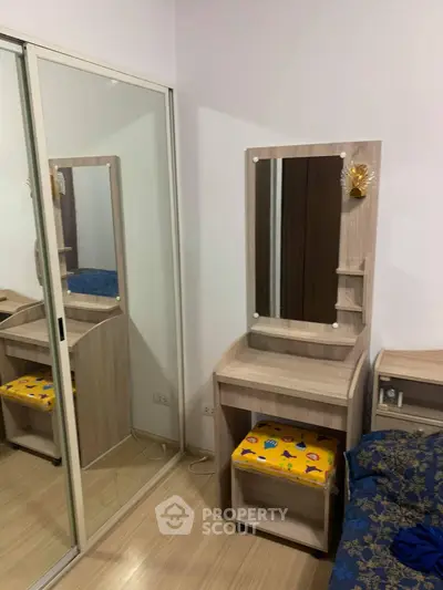 Cozy bedroom with mirrored wardrobe and stylish vanity set