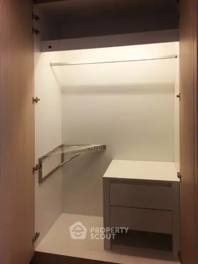 Spacious modern wardrobe with built-in storage and hanging space