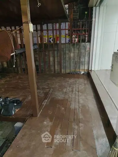 Spacious wooden deck area with potential for outdoor living space.