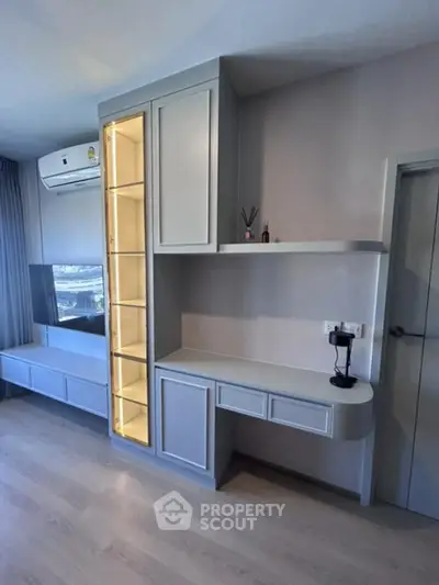 Modern living room with sleek built-in storage and air conditioning