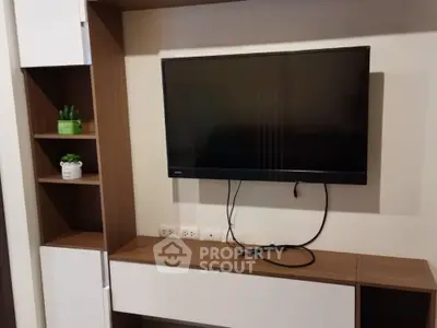 Modern living room with sleek TV unit and stylish shelving