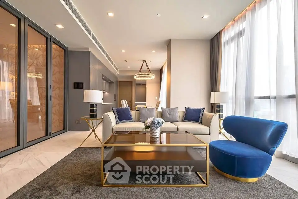Luxurious modern living room with elegant decor and large windows