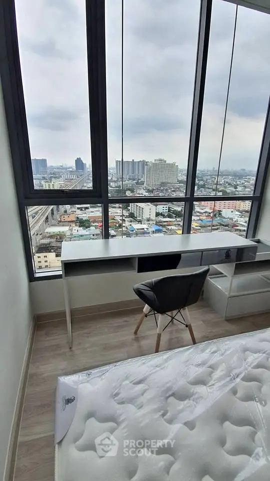 Modern bedroom with stunning city view and sleek furniture
