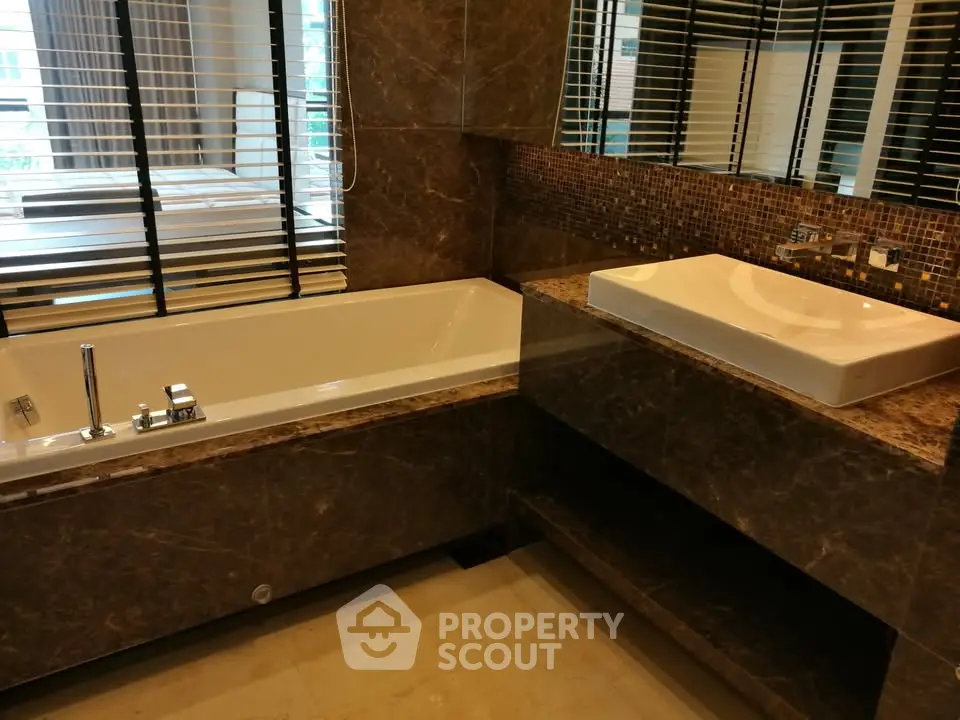Luxurious bathroom with marble finishes and modern fixtures