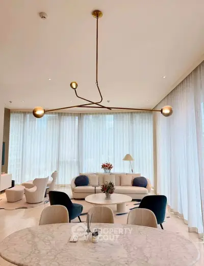 Luxurious modern living room with elegant lighting and stylish furniture, perfect for sophisticated urban living.
