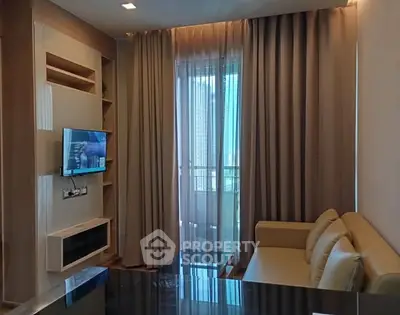 Cozy living room with modern decor and balcony view