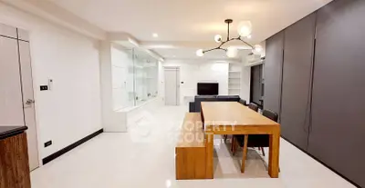 Spacious modern living room with elegant dining area and stylish lighting