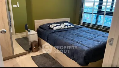 Cozy bedroom with modern decor and large window view