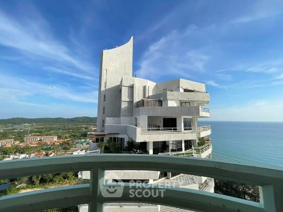 Stunning oceanfront building with modern architecture and expansive sea views.