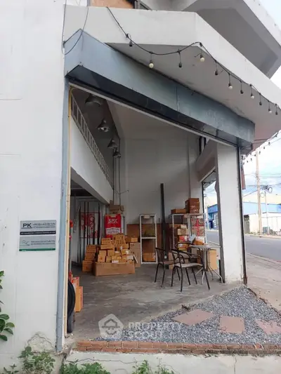 Commercial property with open layout and street view, ideal for business opportunities.