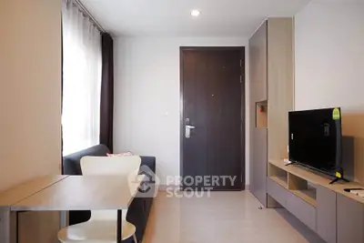 Modern living room with sleek furniture and natural light, perfect for urban living.