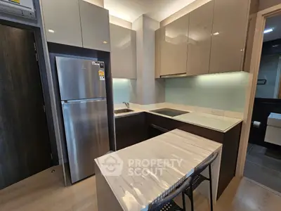 Modern kitchen with sleek cabinetry and stainless steel appliances