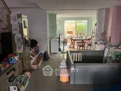 Spacious family living area with play zone and dining space, ideal for modern family living.