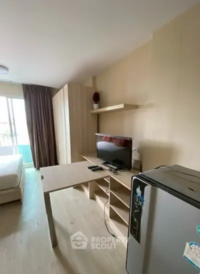 Modern studio apartment with sleek furniture and natural light