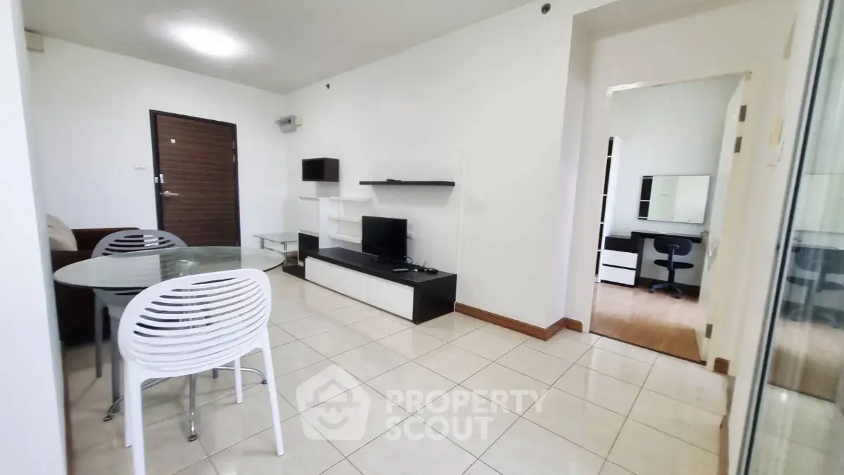 Modern living room with sleek furniture and open layout, perfect for urban living.