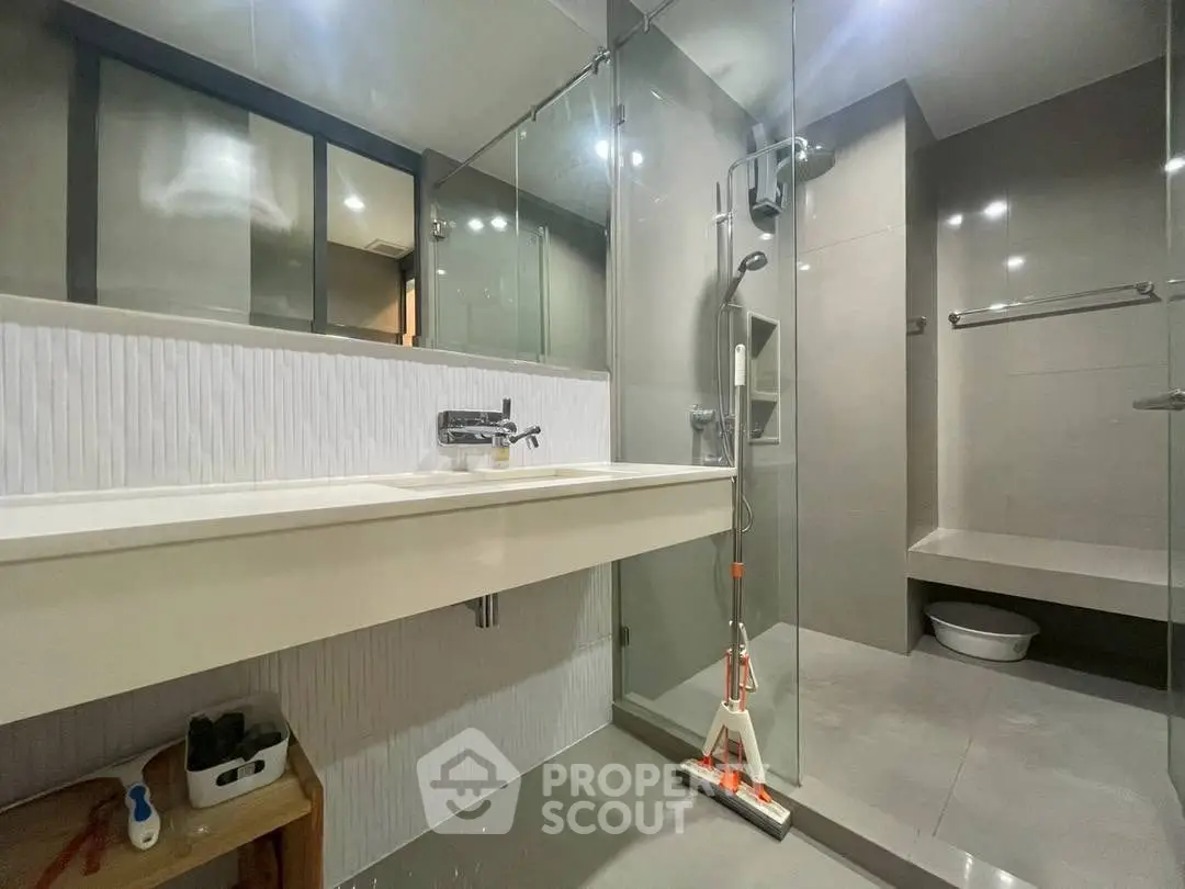 Modern bathroom with sleek design and glass shower enclosure