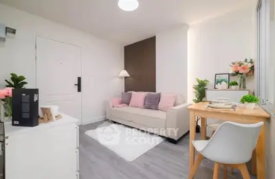 Charming living room with cozy decor and modern furniture, perfect for relaxation and entertaining.