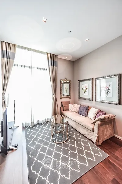 Elegant living room with plush sofa, stylish decor, and large window for natural light.