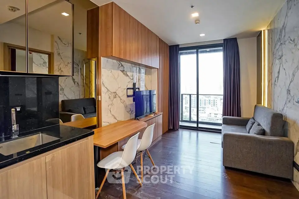 Modern living room with open kitchen and city view balcony in luxury apartment