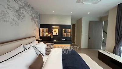 Luxurious modern bedroom with elegant decor and ambient lighting, featuring a cozy bed and stylish wall art.