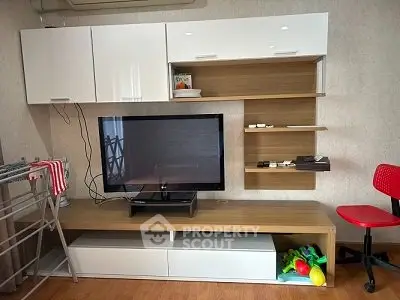 Modern living room with sleek TV unit and stylish shelving
