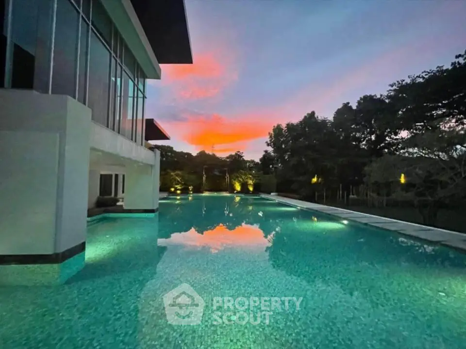 Luxurious modern home with stunning pool and sunset view
