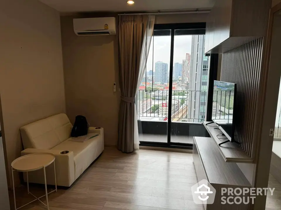 Modern living room with balcony view in high-rise apartment