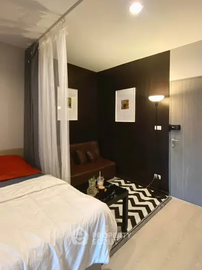 Modern studio apartment with cozy living area and stylish decor