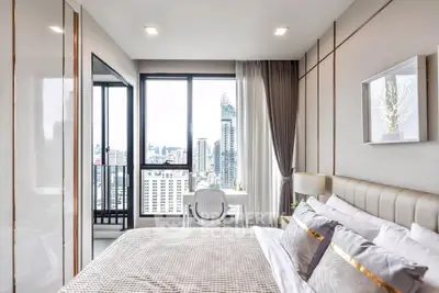 Luxurious bedroom with stunning city view and modern decor