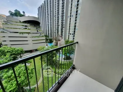 Modern balcony with stunning cityscape view in high-rise apartment complex