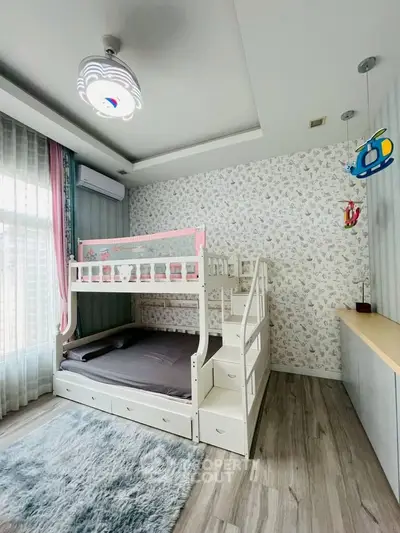 Charming children's bedroom with bunk bed and playful decor, perfect for a cozy family home.