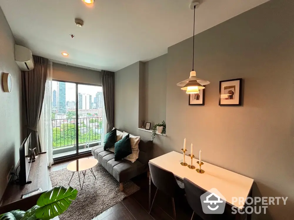 Modern living room with city view, stylish decor, and cozy dining area.